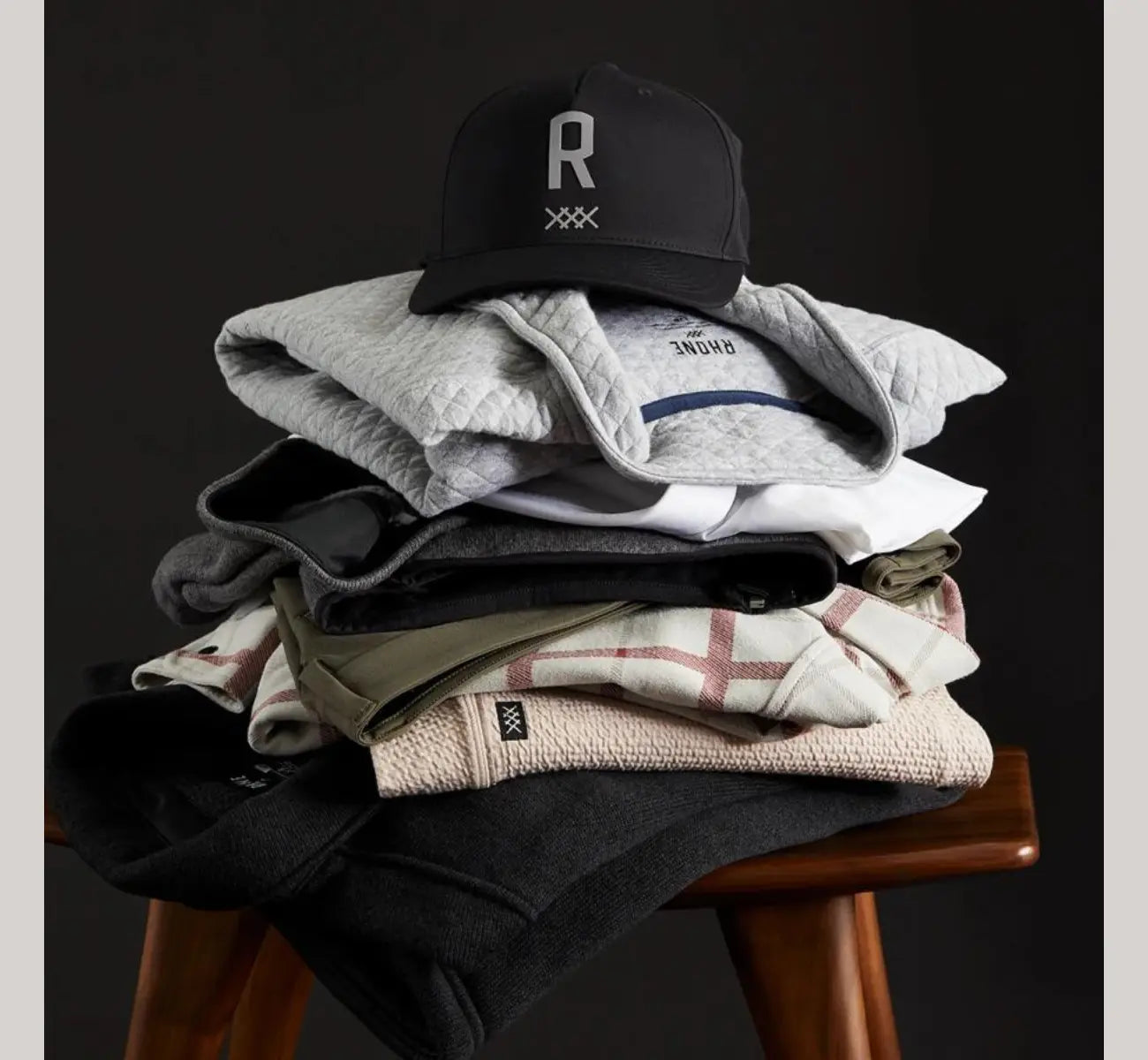 rhone clothing stacked in a pile