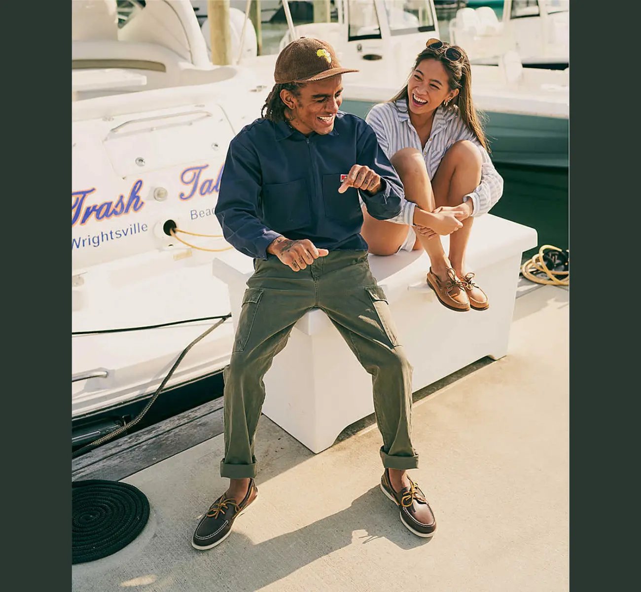 man and woman wearing sperry boat shoes