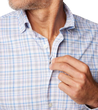 Man wearing a Johnnie-O Alzer Performance Button Up Shirt