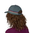 woman wearing a patagonia Line Logo Ridge Stripe Funfarer Cap