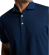 man wearing a peter millar Excursionist Flex Polo in atlantic blue