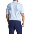 man wearing a peter millar Dazed And Transfused Performance Jersey Polo